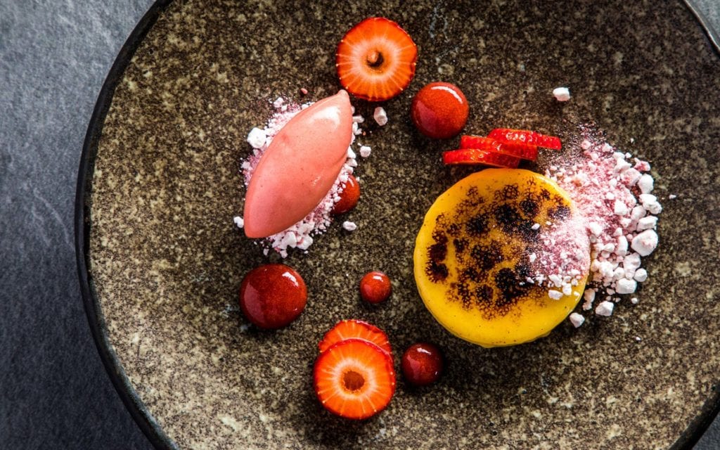 dessert of soured plum dusted with popping citrus candy