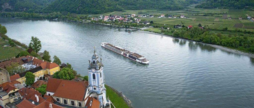 viking river cruises' cruise boat in front of a French town