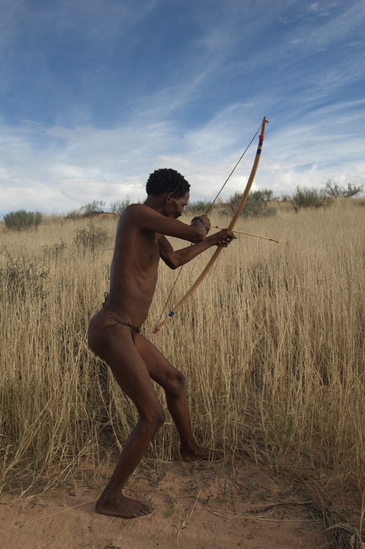Khomani San man hunts in South Africa’s Kalahari Desert