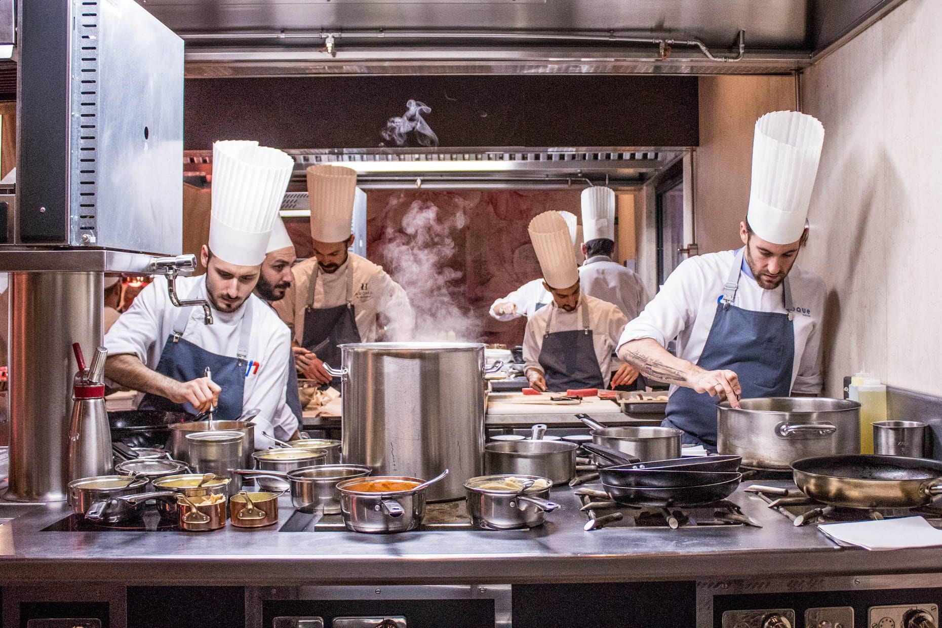 male chefs and sous chefs at the Coque Restaurant