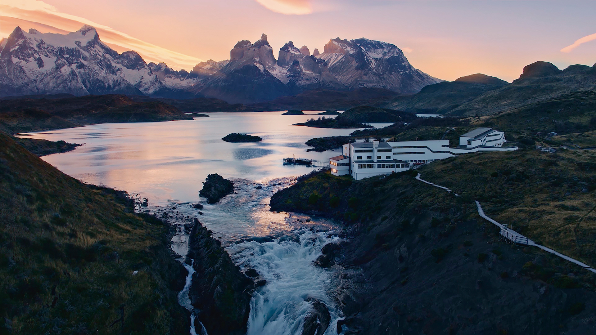 explora's Undurraga Patagonia hotel exterior overlooking mountains and water