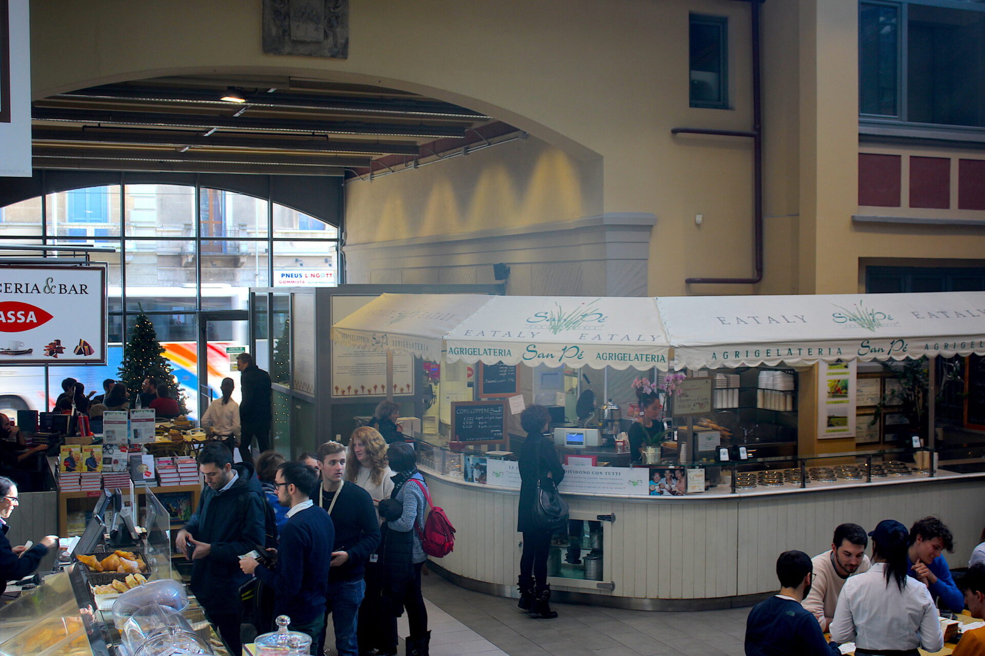 Lunch crowds at indoor food marketing in Piemonte Italy