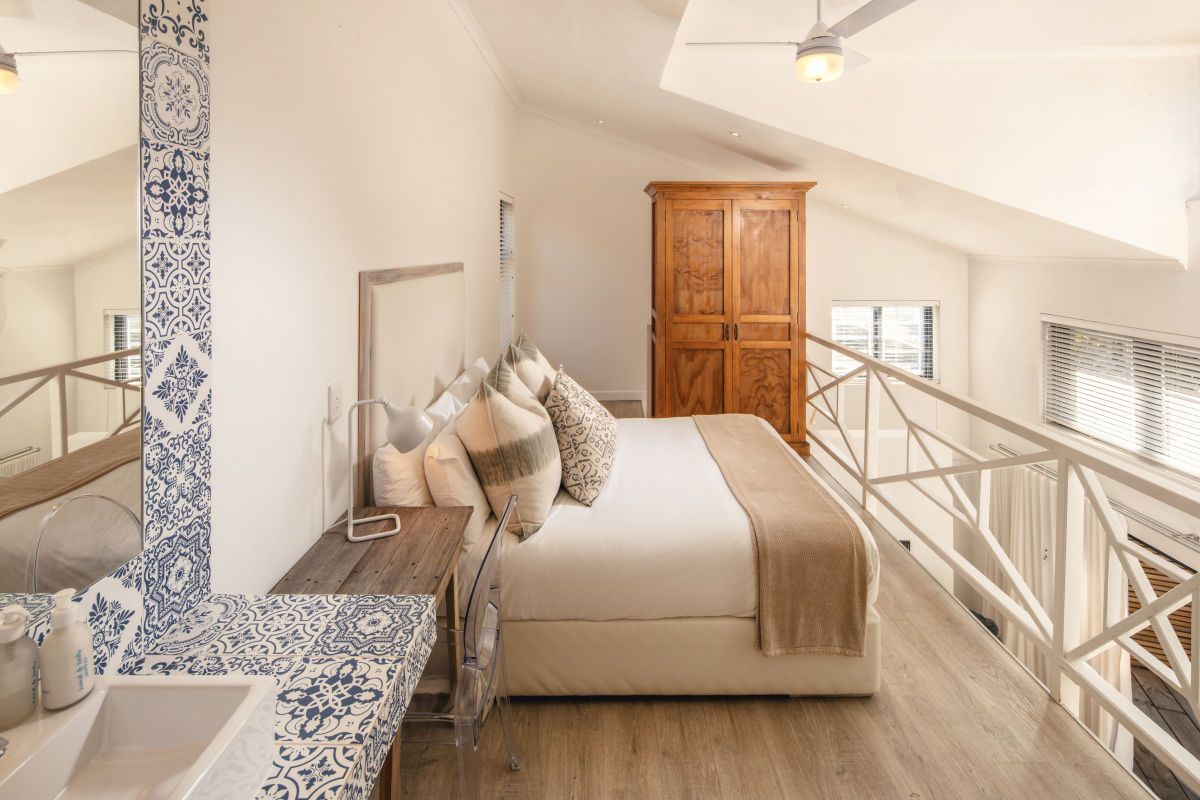 luxury hotel room loft bedroom overlooking private living area
