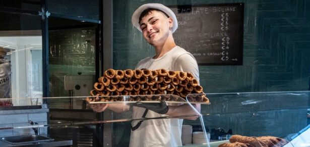 male pastry vendor at the mercato centrale torino