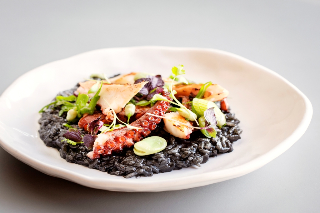 Octopus on squid ink risotto at Hicce Coal Drops Yard