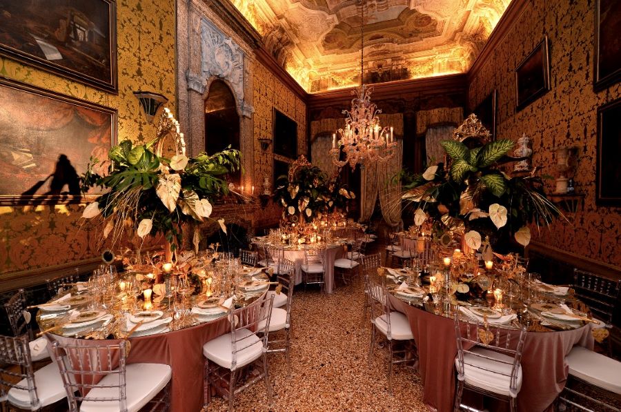 Banquet tables at masquerade ball in Venice
