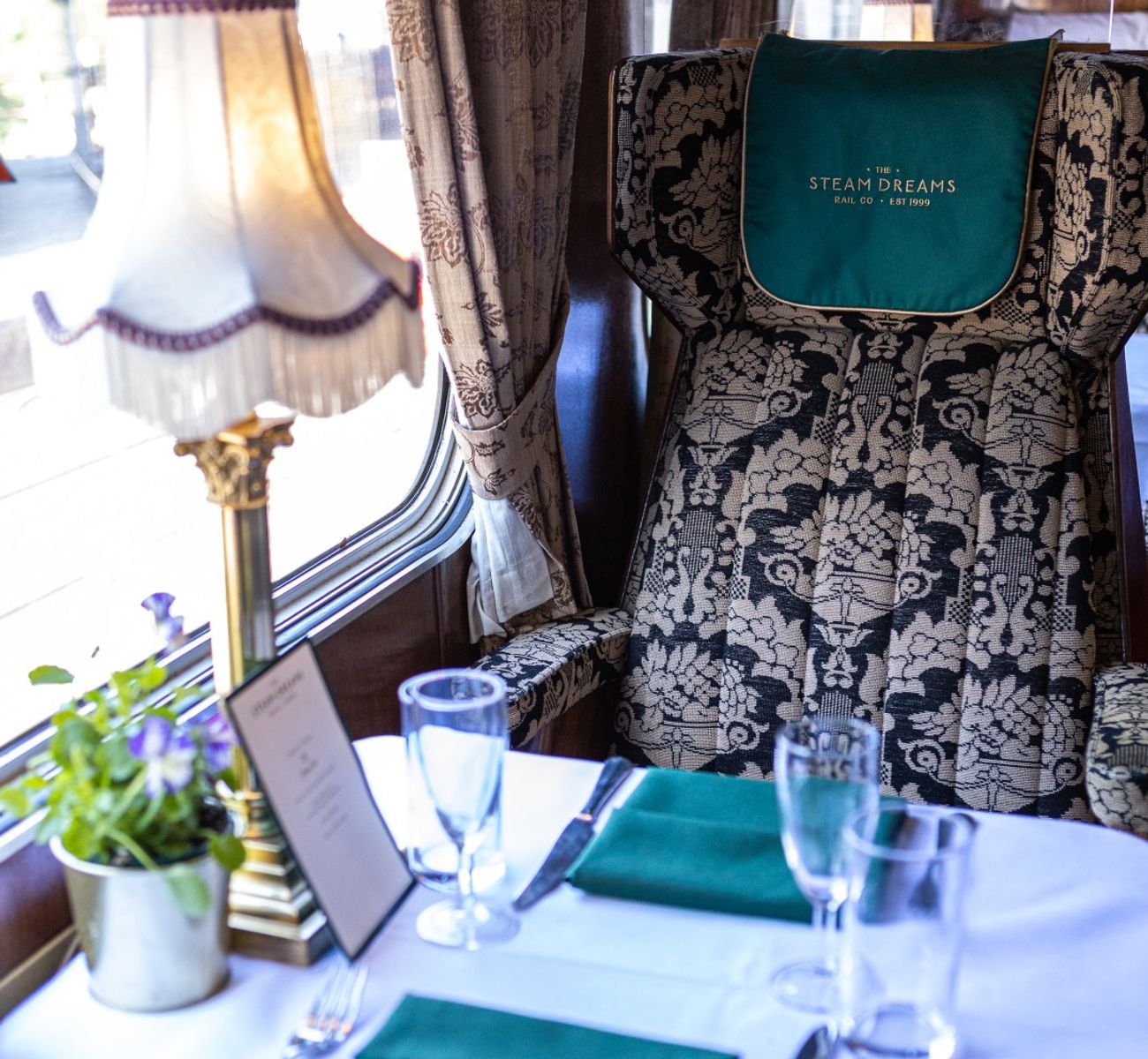 The Christmas steam express is a great addition to a festive itinerary. This image shows a patterned train chair with emerald green decorations.