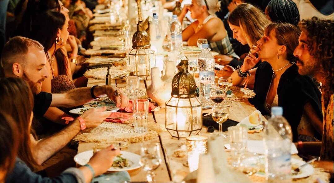 Festival goers attend a private dinner.