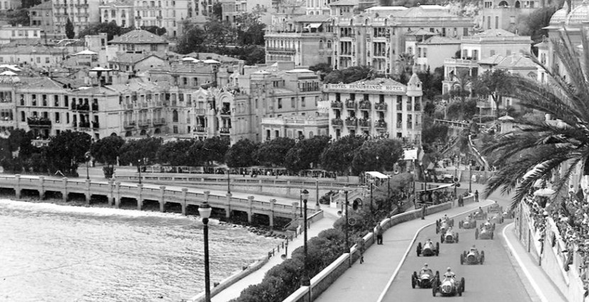 The Monaco Grand Prix in the early 20th century featuring drivers racing up hill along Hercule marina.